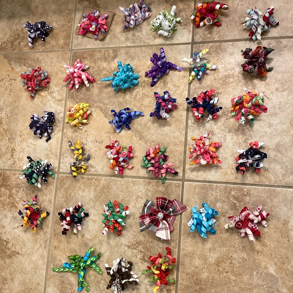 33 sets of Gymboree hair clips/sets.  32  curly set and 1 bow set. EUC